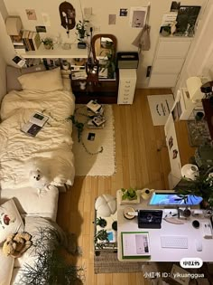 an aerial view of a bedroom with a bed and desk