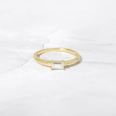 Classic Everyday Yellow Gold Crystal Ring, Everyday Classic Yellow Gold Crystal Ring, Minimalist Vs Clarity Baguette Cut Ring, Everyday Stackable Rings With Baguette Cut, Dainty Emerald Cut Rings For Everyday, Dainty Emerald-cut Rings For Everyday, Dainty Everyday Emerald-cut Rings, Minimalist Gold Baguette Cut Stackable Rings, Minimalist Baguette Cut Gold Stackable Rings