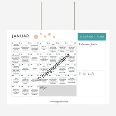 a calendar hanging on a wall with the word january written in black and pink ink