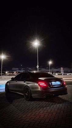 a car parked in the parking lot at night