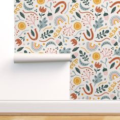 the wallpaper is decorated with colorful flowers and leaves