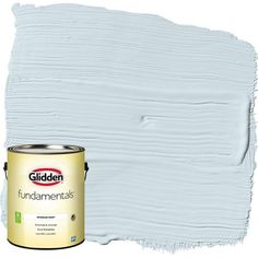 a white paint with the words glidden on it and an empty can in front