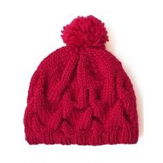 a red knitted hat with a pom - pom