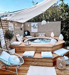 a hot tub sitting on top of a wooden deck