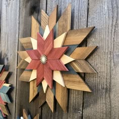 two wooden stars are hanging on the wall