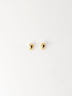 These tiny, sweet little beans are substantial enough to wear as solo studs but also look classy and cute in your second piercing - especially when paired with the Big Bean studs in silver or gold. Sold as a pair. Earring back included. Metal: 14K Gold Plated Minimalist Teardrop Piercings For Everyday, Gold Teardrop Minimalist Piercings, Minimalist Gold Teardrop Piercings, Elegant Everyday Yellow Gold Nose Studs, Elegant Yellow Gold Nose Studs, Classic Gold Piercings With Matching Earrings, Gold Minimalist Studs For Gift, Gold Hypoallergenic Teardrop Piercings, Classic Gold Nose Studs As Gift