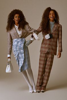 two women dressed in plaid outfits and white gloves