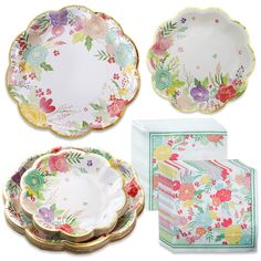 assorted floral plates and napkins on white background with place setting in the middle