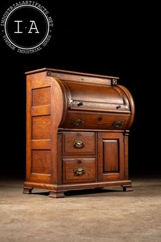 an old fashioned wooden desk with drawers on the top and bottom, in front of a black background