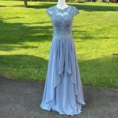 a dress that is on display in the grass