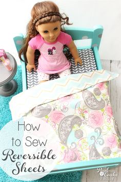 a doll sitting on top of a bed next to a blue blanket and pillow with the words how to sew reversible sheets