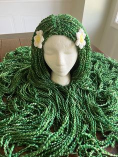 This listing is for a multi colored green wig that can be used for many different characters, including Te Fiti, Mother Earth, Mother Nature, Tree Hugger, or Sea Creature This wig is a crochet hat style with attached strands of hair.  This Wig is made with 2 flowers, but can come without them if preferred, or can be made in a different color. Please write the color difference in the notes, including the inside color, and petal color. This wig will naturally fray at the ends.  Sizes are approximates, and are measured while unstretched. The wig is stretchy, so doesn't need to be exact.   6-12 months: 16-17 inches in circumference                         6 inches in height  Toddler: 17-18 inches in circumference                           6.5 inches in height Child XS (3-4): 18-19 inches in ci Tefiti Wig, Mother Earth Costume, Te Fiti Costume, Earth Costume, Hair Tree, Mother Nature Costume, Te Fiti, Crochet Wig, Earth Mother