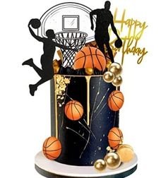 a black and gold birthday cake with basketballs on the top, happy birthday card