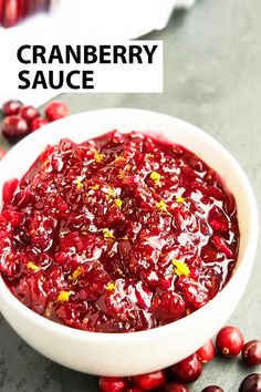 cranberry sauce in a white bowl surrounded by cranberries