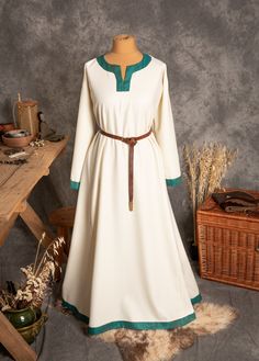 The dress has simple medieval cut with long sleeves, loose and comfortable. The historical pattern - an important element when playing historical realities, especially Vikings or Slavs. Put on your cloak and travel back to the Middle Ages. Hunting, ancient legends, the warmth of the hearth and our dress will give you an unforgettable experience. The simple cut of the dress allows you to move freely, as well as boldly add accessories to the dress. The dress will perfectly fit into the basic wardr Fall Medieval Dress With Long Sleeves, Long Sleeve Medieval Dress With Historical Design For Fall, Fall Medieval Dress With Historical Design, Long Sleeve Dresses For Medieval Festivals, Long Sleeve Medieval Dress With Historical Design For Festivals, Traditional Long Sleeve Dresses For Medieval Festivals, Viking Style Long Sleeve Medieval Dress For Festivals, Viking Style Medieval Dress With Long Sleeves, Viking Style Long Sleeve Medieval Dress