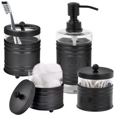 black bathroom accessories including soap dispenser and toothbrush holder