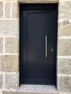 a black door with a metal handle on it