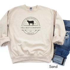 Advertise your cattle farm/ranch! Perfect to wear at your local farmer's market or a gift for the rancher/farmer! Steer version available in separate listings. >>Be sure to include your custom text in the personalization box below including the year your farm was started, name & location! If your farm name is a longer one (more than 12 letters) the letters may have to be condensed/decreased in size to fit the text if you want the word farm included. PLEASE include the word farm/ranch after the name if you would like it included. AND double check all spelling as it will be printed exactly as typed in the personalization box. Thank you! BELLA CANVAS T-SHIRT available here: https://www.etsy.com/listing/1654314632/custom-cattle-beef-farm-tee-local-dealer?click_key=e81fca58ea7f950083bdce639bbe1 Farm Merch, Beef Farming, Farm Sweatshirt, Cattle Farm, Farm Tees, Cattle Brands, Eat Beef, Farm Ranch, Beef Cattle