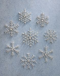 six snowflakes are shown on the ground