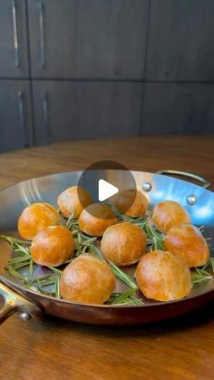 a pan filled with food on top of a wooden table