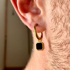 18K Gold / Silver Hoop with Onyx Gemstone Dangle Perfect for men & women - A quality gift. Size of hoop: 1.6cm / 0.63 inches Size of onyx charm: 0.75cm / 0.3 inches Total length: 2.35cm / 0.93 inches ✔️Safe to wear in water ✔️100% Nickel free- Ideal for daily wear. ✔️Made from stainless steel / 18K Gold PVD Plating - this piece will not tarnish! ✔️Natural onyx gemstone used ✔️Gemstone is also available on a chain here: https://www.etsy.com/uk/listing/1279453952/mens-necklace-mini-black-onyx-silv Men's Earrings Pearl, Dangly Earrings Men Diamond, Dangly Pearl Earrings Men, Luxury Polished Finish Men's Earrings, Luxury Minimalist Men's Huggie Earrings, Dangle Earrings Men, Mens Earrings, Vintage Glasses Frames, Men's Earrings