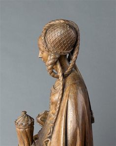 a statue of a woman holding a vase