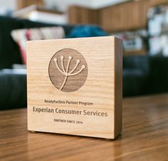 a wooden box with the words experian consumer services on it sitting on a table