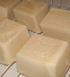 four pieces of soap sitting on top of a rack