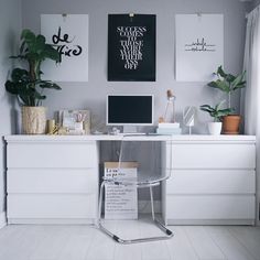 a white desk topped with a computer monitor