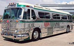 an old bus is parked in the parking lot