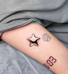 a person with a star tattoo on their arm