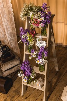 a wooden ladder with flowers on it