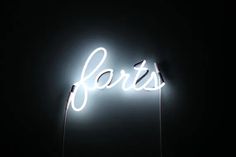 a neon sign that says paris on it