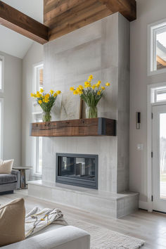 a living room filled with furniture and a fire place covered in yellow daffodils