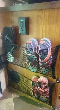 there are many pairs of shoes in the shoe rack