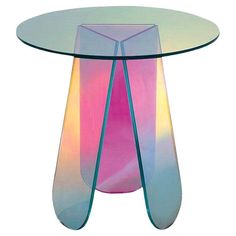 a glass table with an abstract design on it's top and bottom, sitting against a white background