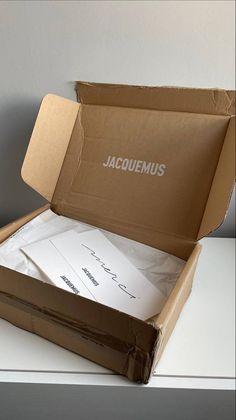 an open box with some papers in it