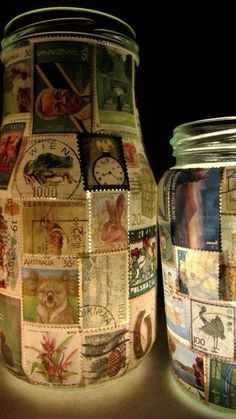 two glass jars with stamps on them sitting next to each other in front of a black background