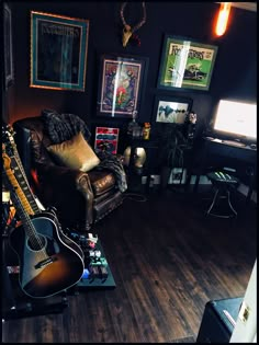 a living room filled with furniture and a guitar