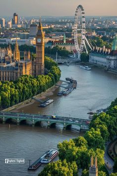 an aerial view of the river thames with big ben in the background and other buildings