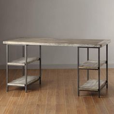 a wooden table sitting on top of a hard wood floor