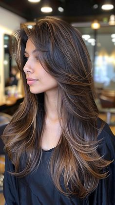 28 Feathered Haircuts for a Chic and Trendy Appearance New Trendy Haircut For Women, Feather And Layer Haircut, Latest Hair Cuts For Long Hair, Feathercuts Haircut, Feathered Medium Length Hair, Long Haircut With Long Layers, Latest Haircut For Women Long Hair, Feather Haircut Long, Feather Layer Haircut