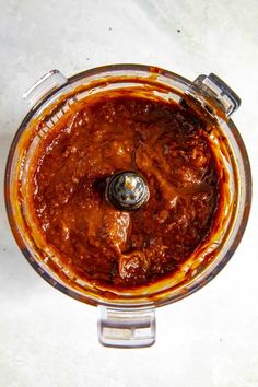 an overhead view of a food processor filled with sauce