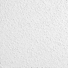 a white wall that has some black and white paint on it