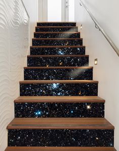 the stairs are covered with black and white stars