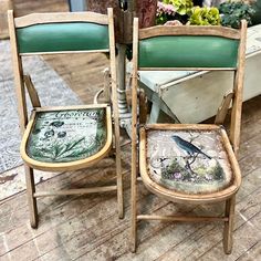 two chairs sitting next to each other on top of a wooden floor in front of a potted plant