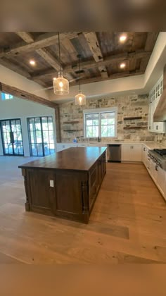 a large kitchen with an island in the middle