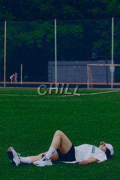 a person laying on the ground in front of a soccer goal with words chill above them