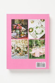 a pink book with pictures of flowers and other things on the cover, sitting on a white surface