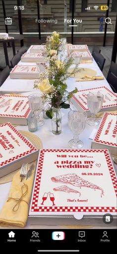 the table is set with place mats, napkins and utensils on it